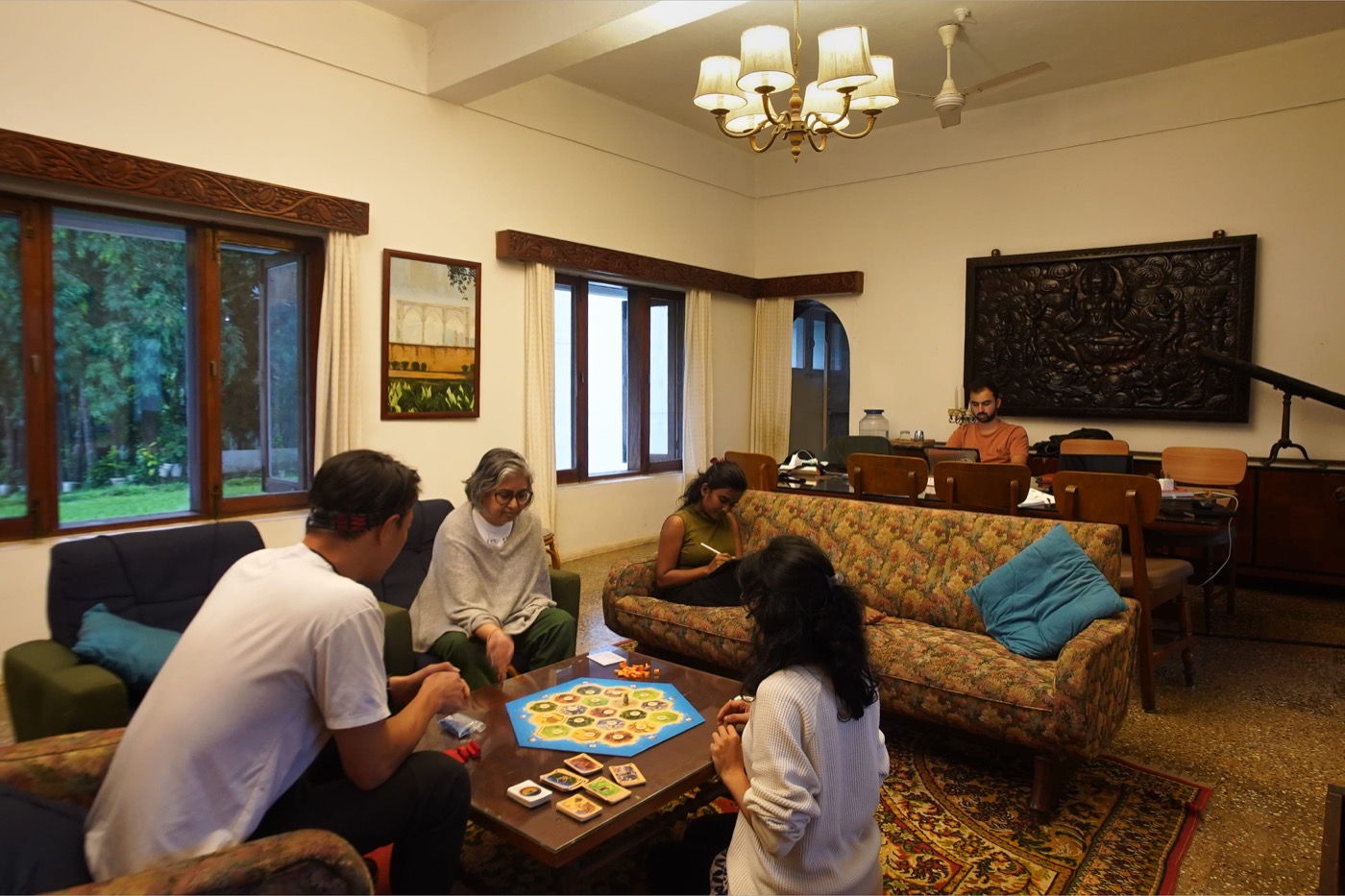 Residents playing board games in the heritage living room