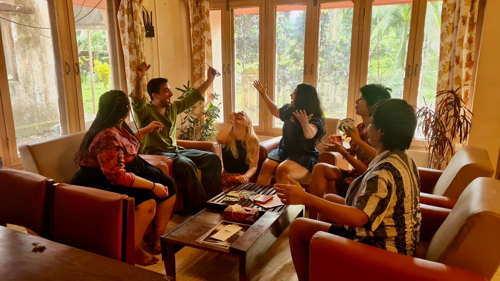 Residents playing games and laughing in the coliving lounge